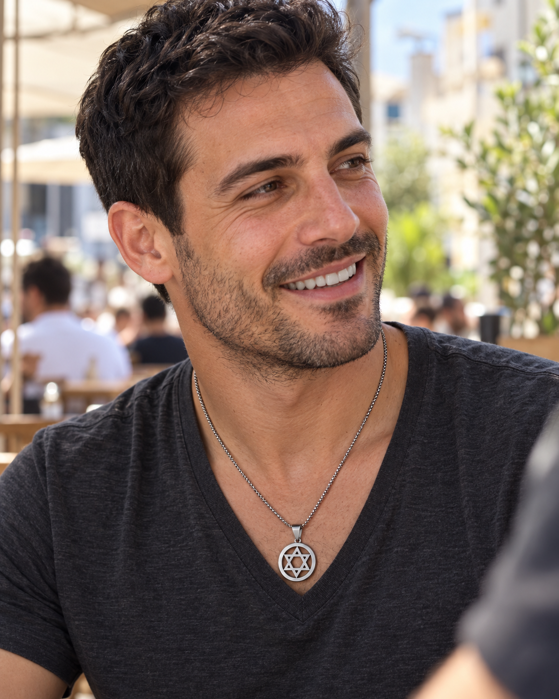 Man wearing the silver Open Star of David necklace