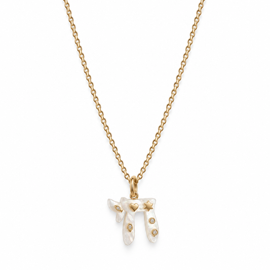Mother of pearl Chai necklace with heart, star and cubic zirconia accents on a gold chain, on white background